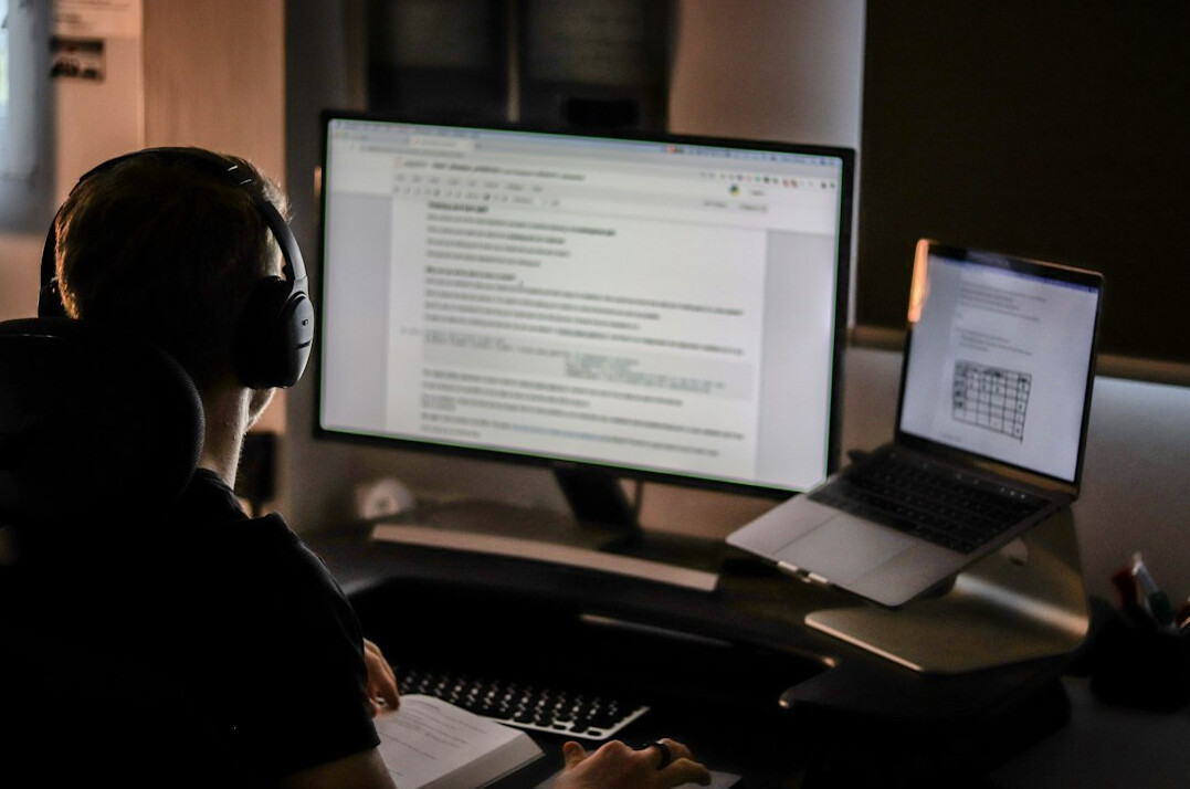 programmer coding at desk