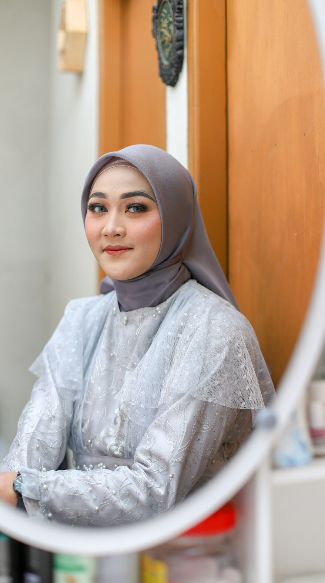 Malaysian Malay woman data analyst smiling at camera