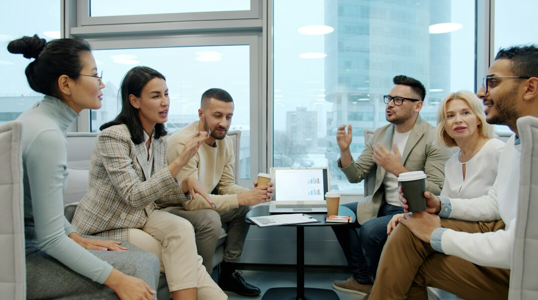 team discussing insurance tech