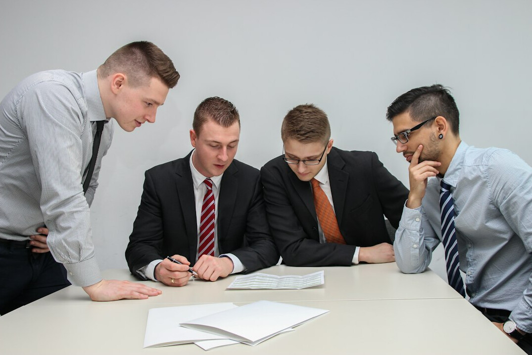 team discussing insurance tech